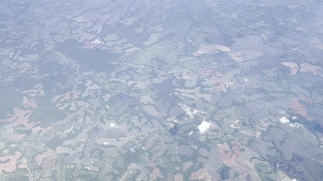 View from an airplane window flying over the mountains in Costa Rica en route to San Jose International Airport.