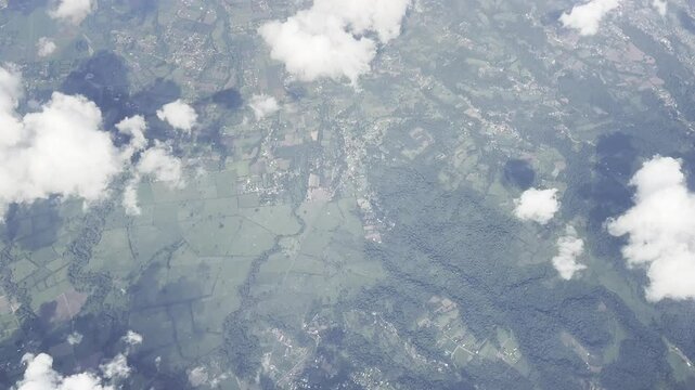 View from an airplane window flying over the mountains in Costa Rica en route to San Jose International Airport.