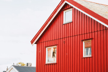 Traditional red house with bright red roof and windows