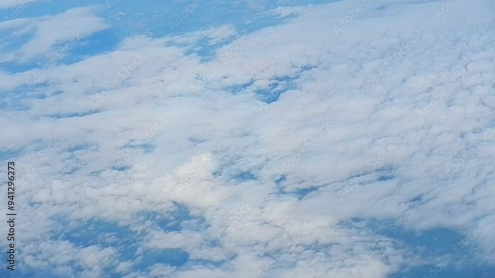 Poster flight above land and stratocumulus low level clouds texture and brocken spectre with colorful glory