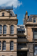 Obraz premium Historic architecture juxtaposed with modern design near National Museum of Scotland