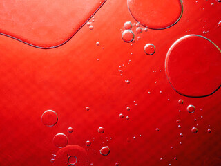 Abstract Background Red oil Macro Colorful artistic of oil drop floating on the water. macro red bubble oil of wallpeper, blood concept