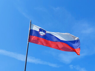 flag of Slovenia. blue sky. windy