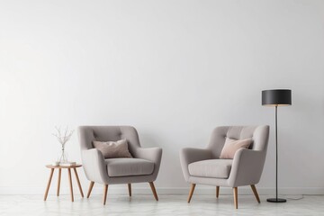 Two Grey Armchairs with Pillows and a Floor Lamp in a Minimalist Living Room