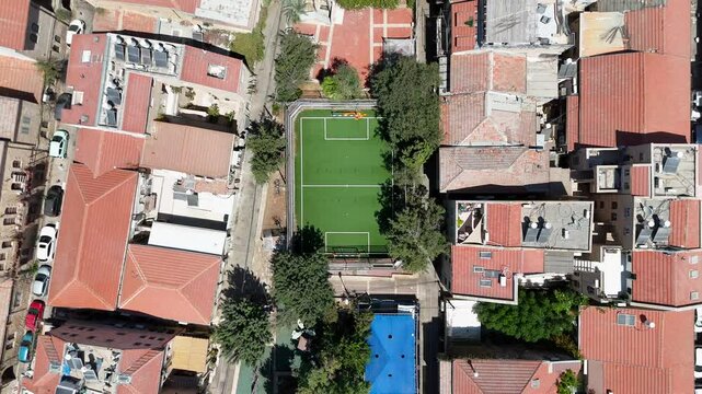 Green soccer field in the heart of Jerusalem Mahane Yehuda area, Top down view