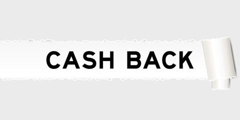 Ripped gray paper background that have word cash back under torn part