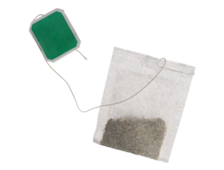 New tea bag with green tab isolated on white