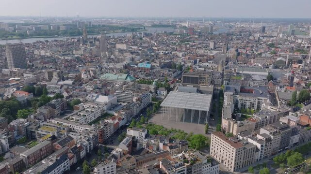Panoramic views of Antwerp, Belgium, highlight Stadsschouwburg Antwerp theatre. The river scheldt flows elegantly in the background, complementing the urban scenery
