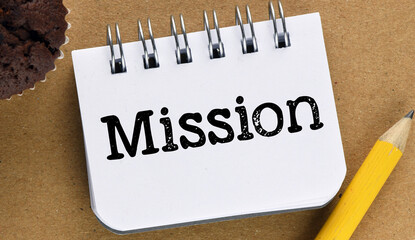 MISSION word in an office notebook.