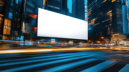 A blank billboard in a vibrant cityscape illuminated by nighttime lights and motion blur from passing vehicles.