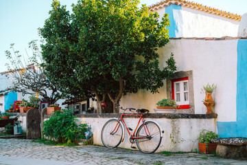 Red Bicycle on Street in Aldeia da Mata Village, Portugal