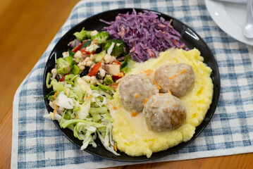 Home made meat dish with salads, in hands dinner cutlet