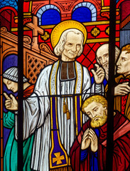 Fototapeta premium Stained glass of St. John Marie Vianney, Priest of Ars. Vitrail moderne de Saint Jean-Marie Vianney, Curé d'Ars.