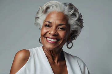 Portrait of mature attractive black woman on white background. senior woman with gray hair and brown eyes
