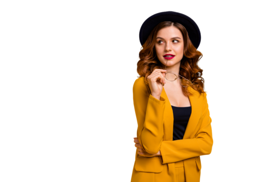 Portrait of her she nice-looking charming cute attractive lovely intellectual smart clever luxury wavy-haired lady in yellow suit looking aside isolated on bright vivid shine orange background - Powered by Adobe