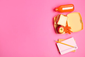 Lunch box with snacks, bottle of juice and stationery on pink background, flat lay. Space for text