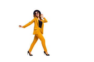 Full length side profile body size photo beautiful amazing funky she her lady walking down street perfect look tourism traveler wear specs formal-wear costume suit isolated yellow bright background