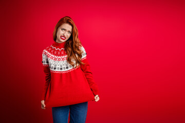 Photo of young upset lady showing her worst present seasonal sweater for happy new year holiday...