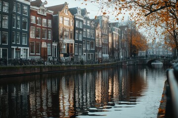 Fototapeta premium Canal in Amsterdam with Buildings Reflecting in Water