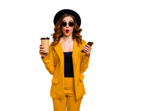 Close up photo beautiful funky she her lady open mouth amazed hands arms telephone vacation traveler hot beverage paper container reader wear specs formal-wear suit isolated yellow bright background