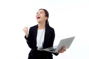 Portrait young asian businesswoman in suit celebrating success while holding a laptop isolated white background, business woman holding notebook expression with achievement and winning.