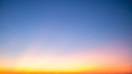 Obraz premium Beautiful , luxury soft gradient orange gold clouds and sunlight on the blue sky perfect for the background, take in everning,Twilight, Large size, high definition landscape photo