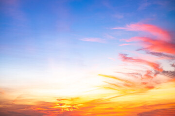 Obraz premium Beautiful , luxury soft gradient orange gold clouds and sunlight on the blue sky perfect for the background, take in everning,Twilight, Large size, high definition landscape photo