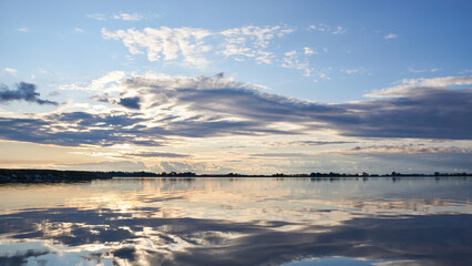 Beautiful clouds in a lagoon with the sunset Horizontal