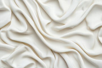 Fototapeta premium Image of smooth, flowing white fabric with soft folds and elegant texture, perfect for backgrounds, fashion designs, and creative projects.