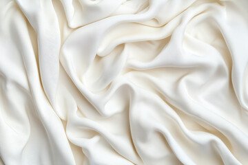 Fototapeta premium Elegant white silk fabric with smooth folds and gentle texture, perfect for background or design use.