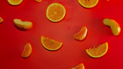 fresh organic fruits decorated with patterns on red background 