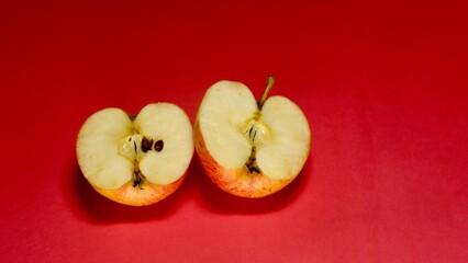 Fresh apple cutting slice on red background 