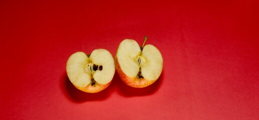 Fresh apple cutting slice on red background 