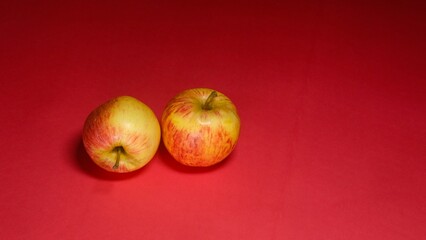 Fresh apple cutting slice on red background 