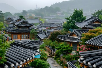 Fototapeta premium Serene View of Traditional Korean Hanok Village Amidst Lush Greenery