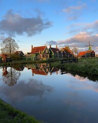 Obraz premium rural dutch country skyline of small old town Zaanse Schans at sunset, Netherlands
