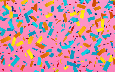 Colorful confetti scattered on a pink background, creating a festive and vibrant atmosphere perfect for celebrations and parties.