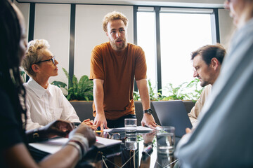 Team of professionals discussing a project in a collaborative business meeting