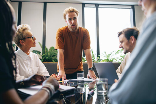Team of professionals discussing a project in a collaborative business meeting