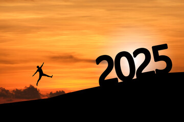 Concept Happy new year 2025 Silhouette image of happy man jump to 2025 on beautiful sunrise.