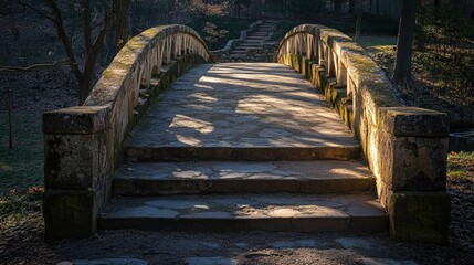 A stone bridge with weathered steps leading up to it, casting long shadows in the early morning light, creating a peaceful and nostalgic atmosphere.