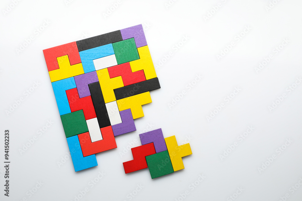 Poster Colorful wooden puzzle pieces on white background, top view. Space for text