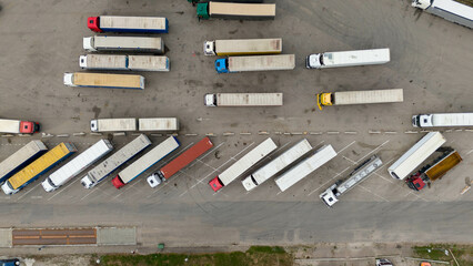 Drone photography of logistic warehouse and parked lorry’s during summer day