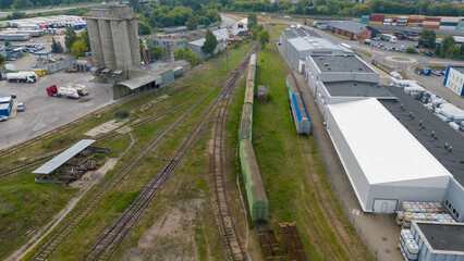 Drone photography of a railway in an old industrial part of a city during summer day