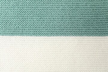 Texture of colorful knitted fabric as background, top view