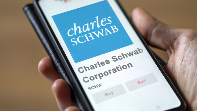 April 09th 2024 , Westlake, Texas. Close up on logo of Charles Schwab Corporation on the screen of an exchange. Charles Schwab Corporation price stocks, $SCHW on a device.