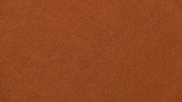 Soft Knitted Woolen Detailed Texture. Natural Fabric Closeup Knit Pattern. Brown Knitwear, Warm Cashmere Surface. Rotation, Macro. Cozy Textile Background. Clothes Production. Melange Yarn. Terracotta