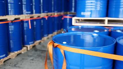 Warehouse with 200-liter barrels lined up, indicating readiness for chemical or oil shipment and logistics.