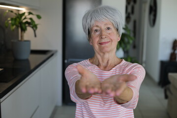 Senior woman supporting cooperation with hand gesture 