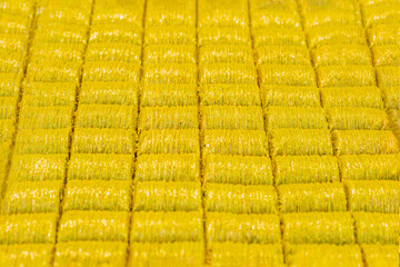 Fototapeta premium Rows of golden, crispy baklava neatly arranged in a pattern
